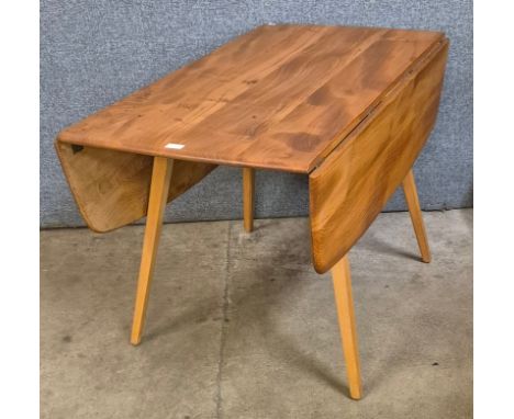 An Ercol Blonde elm and beech Windsor drop leaf table 