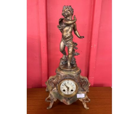 A 19th Century French gilt metal and onyx figural mantle clock 