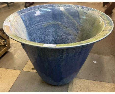 A turquoise glazed garden planter 