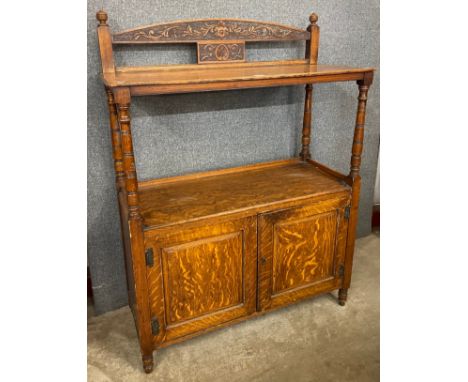 A Victorian Aesthetic Movement carved oak buffet sideboard 