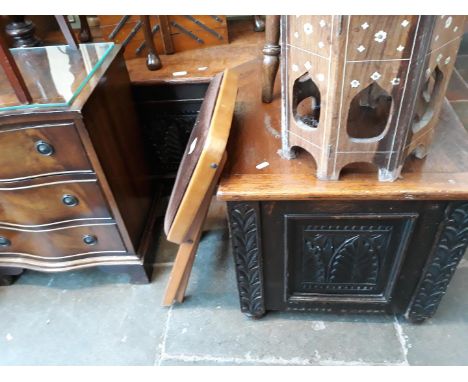 A carved oak corner bench. 