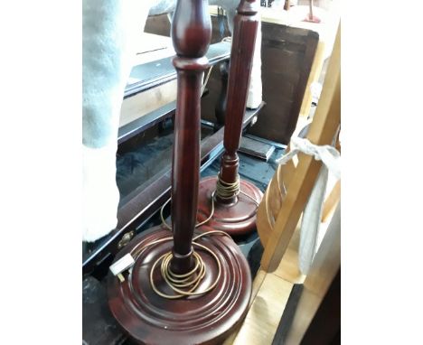 A pair of reproduction mahogany lamp standards. 