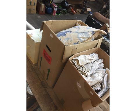 Two boxes of curtains and cushions and a boxed dinner set 