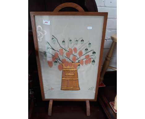 A needlework firescreen. 