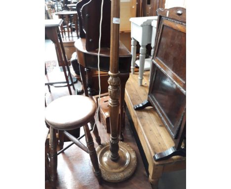 A carved beech standard lamp. 