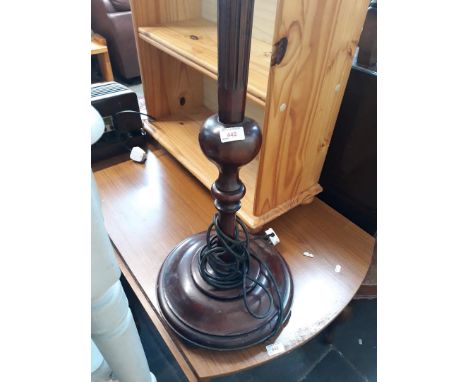 A fluted mahogany standard lamp. 