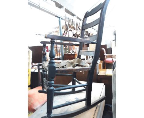 A Lancashire ladder back rocking chair. 