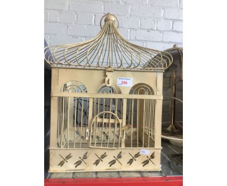 A bird cage and a metal decorative item 