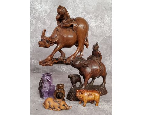 Oriental Objects - A Chinese carved amethyst or quartz monkey; Japanese netsuke in the form of a hand holding a monkey, signe