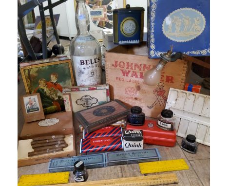 Advertisement - a Johnnie Walker red label scotch whisky crate, with Rhodesia postage export stamps; a large Bell's Old Scotc
