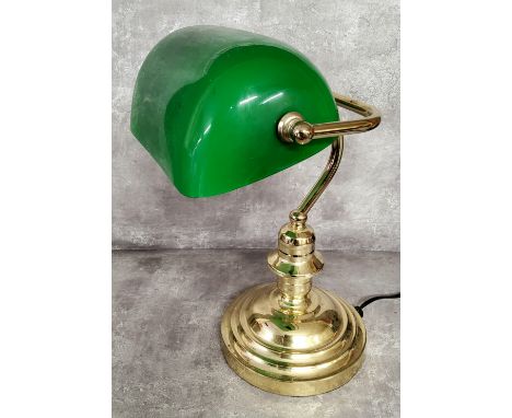 A library desk reading lamp, swivel green shade on a turned brass weighted base 