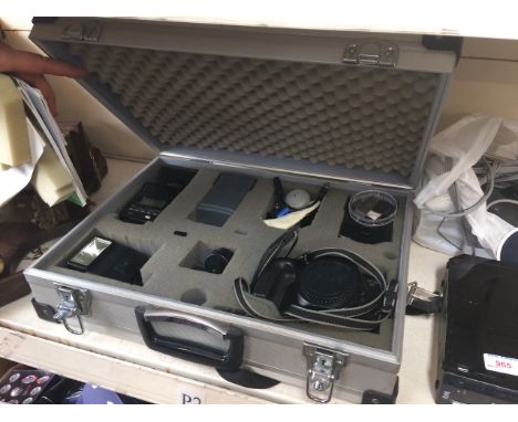 Canon EOS RT 35mm camera and accessories in a case 