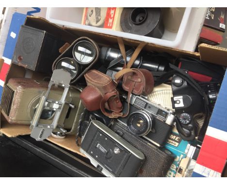 A box of cameras, binocular and a projector 