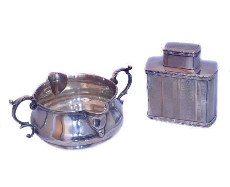 An Edward VII silver tea caddy. Deakin &amp; Francis, London, 1905, together with a Victorian double spout sauce boat, gross 