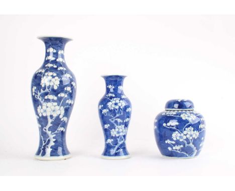 Two Graduated Chinese Blue and White "Prunus" Vases and a Ginger Jar Two Graduated Chinese Blue and White "Prunus" Vases and 