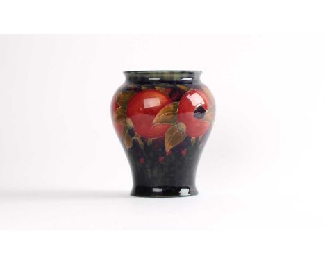 William Moorcroft "Pomegranate" Vase Circa 1930, inverted baluster form, signed and with impressed marks to base.16.5cm highT