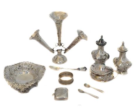 A selection of silver. To include a bonbon dish by William Comyns, a cruet set, an epergne, vesta case, napkin ring, and comm