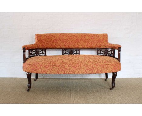 An Edwardian Mahogany Framed Parlour Settee An Edwardian Mahogany Framed Parlour Settee, upholstered in floral fabric, with p