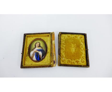 An oval portrait miniature depicting 'The Virgin Mary' in a small leather frame