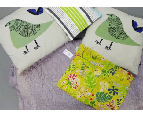 A mauve coloured quilt together with three contemporary cushions and a Linum floral panel (5)