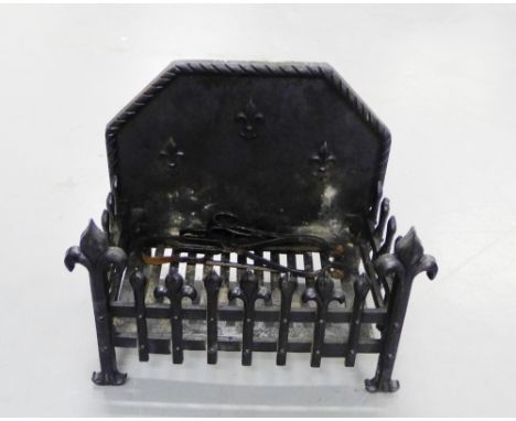 A cast iron black painted fire grate with fleur de lys decoration, 51 x 40cm, together with black iron fire tools (3)