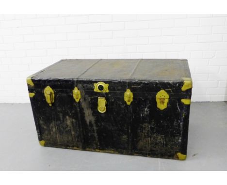A vintage black painted metal trunk with brass fittings, 55 x 107cm