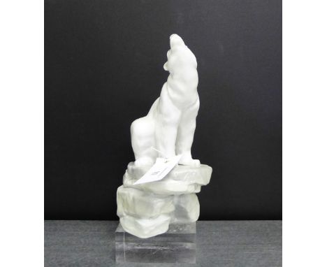 A Nao Spanish porcelain model of a Polar Bear, modelled seated upon a rocky plinth base, 24cm high