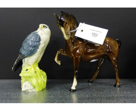 A Beswick horse, together with a Royal Doulton Whyte and MacKay Scotch Whisky merlin decanter (2)