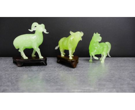 A group of three green jade animals to include a ram, a buffalo and a horse (3)