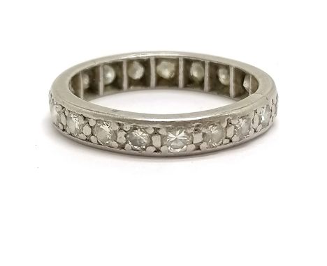 Unmarked white gold (touch tests as 18ct) diamond set eternity ring - size L &amp; 3.7g total weight ~ ring is approx 3.3mm w