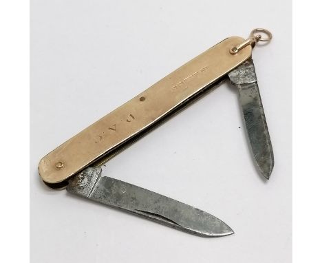 9ct gold mounted penknife with two blades 8cm long - total weight 21g- has a slight distortion to panel on 1 side and dents 