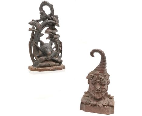 2 x cast iron doorstops ~ fox hunting related (28cm) &amp; green man (old repair to top of hat)