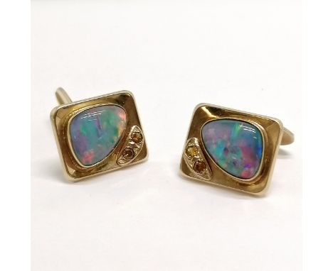 Pair of 9ct marked gold opal / yellow stone set cufflinks - 18g total weight ~ 1 yellow stone has a chip 