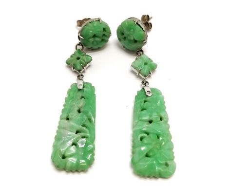 Chinese hand carved panel pair of earrings set in white metal - 5.5cm drop and both have old repairs to top mounts 