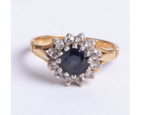 An 18ct sapphire and diamond 13 stone cluster ring, size K.