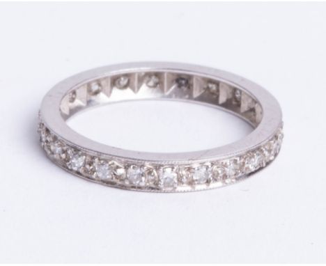 An unmarked, white gold? 22 stone diamond full eternity ring, size K.