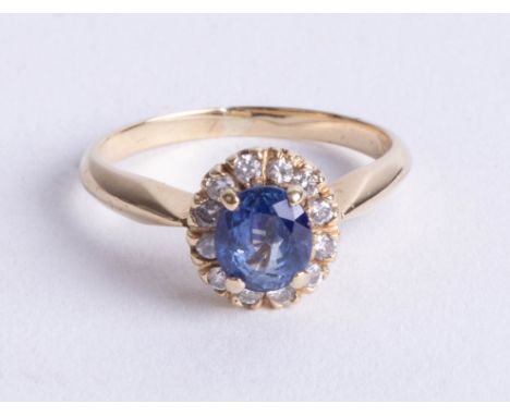 A 14ct sapphire and diamond set cluster ring, size K.