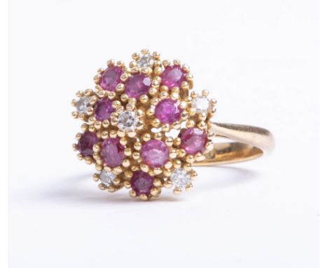 An 18ct ruby and diamond 16 stone cluster ring, size N.