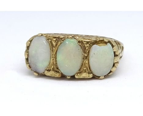 A 9ct opal three stone ring, size T.