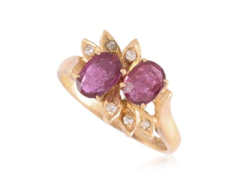 A RUBY AND DIAMOND RING
Featuring two cushion cut rubies totalling approximately 0.90 Cts, mounted in a yellow gold setting m