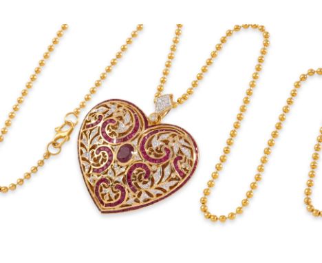 A RUBY AND DIAMOND 'HEART' LOCKET ON A HIGH KARAT GOLD CHAIN
Featuring an oval cut ruby mounted in a two tone gold setting ma