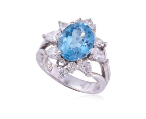 A TOPAZ AND DIAMOND RING
Featuring a blue topaz weighing approximately 3.00 Cts, mounted in a white gold setting marked '750'