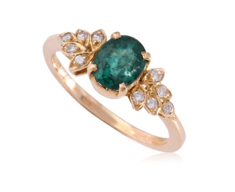AN EMERALD AND DIAMOND RING
Featuring an oval shaped emerald weighing approximately 0.80 Cts, mounted in an unmarked yellow g