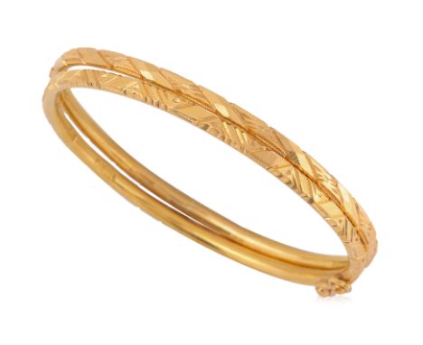 TWO HIGH KARAT GOLD BANGLES
Featuring two high karat gold bangles with various marks, including '22', likely for 22K, to the 