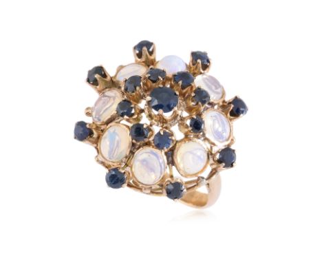 A SAPPHIRE AND OPAL COCKTAIL RING
Featuring round cut sapphires totalling approximately 1.40 Cts, mounted in an unmarked yell