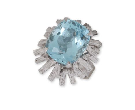 A LARGE AQUAMARINE 'BARK' TEXTURED RING
Featuring a cushion cut aquamarine weighing approximately 10.0 Cts, mounted in a text