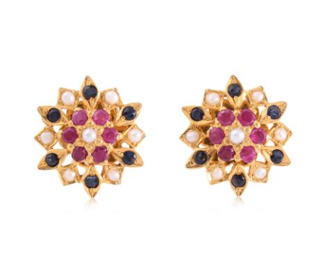 A PAIR OF RUBY, SAPPHIRE AND SEED PEARL 'FLOWER' SCREW-ON EARRINGS
Featuring round cut rubies and sapphire totalling approxim