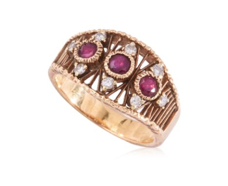 A RUBY AND DIAMOND RING
Featuring round cut rubies totalling approximately 0.60 Cts, mounted in a yellow gold setting marked 
