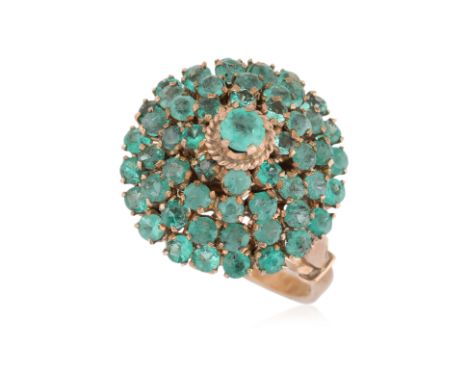 AN EMERALD 'DOME' RING
Featuring round cut emeralds totalling approximately 1.50 Cts, mounted in a yellow gold setting marked