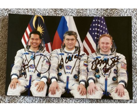Space Cosmonauts Soyuz TMA-11 Back Up Crew Portrait signed By Whole Crew. Faiz Khaled, Salizhan Sharipov, Michael Fincke. 6 x